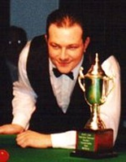 Shawn Budd with an Australian Championship trophy at the table
